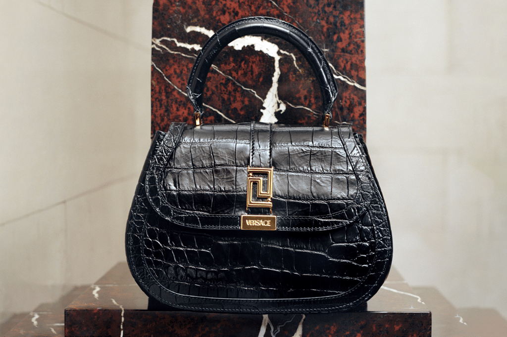The Versace Greca Goddess top handle bag is from a higher being