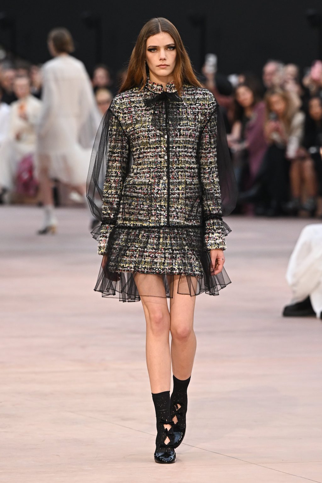 Bold eyeliner and house signatures at Chanel FW25