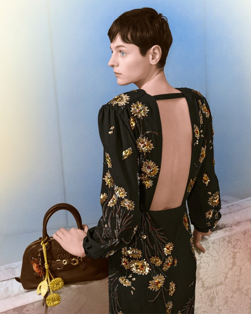 Actress Emma Corrin appears in Sapphire Blue for Miu Miu's 2024 Holiday Campaign